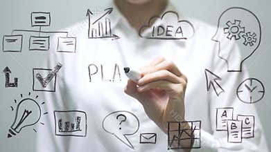 Woman writing PLANNING on transparent screen. Businesswoman write on board.
