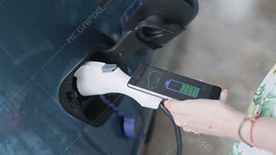 The app on phone connects with electric car and displays the auto battery charge