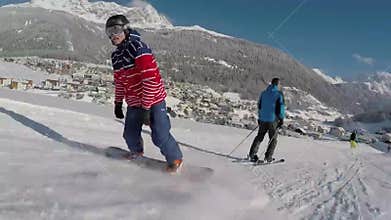 Snowboarders on slopes