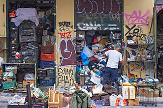 Man closing his shop at flea market in Athens