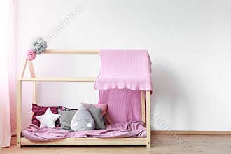 Pink blanket on girls bed