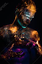 Portrait of a man painted in fluorescent UV colors.