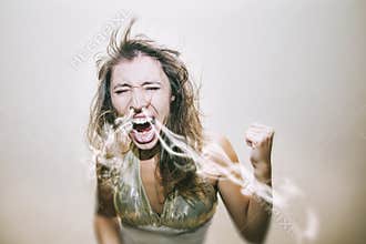 Woman screams and swears a smoke from his nose in a fit of emotion and anger