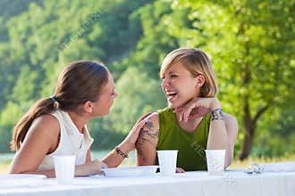 Female friends picknicking