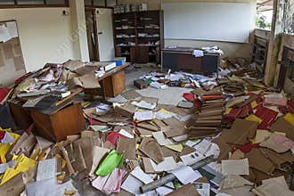 MESSY OFFICE FULL OF FOLDERS AND PAPERS
