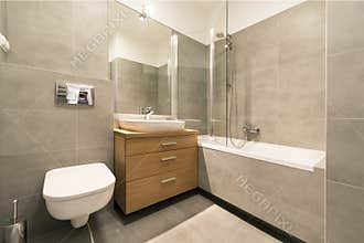Modern bathroom with tiles on the floor