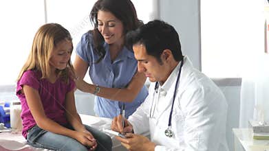 Mother And Child Visiting Doctor's Office