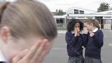 Schoolgirl Being Bullied In Playground