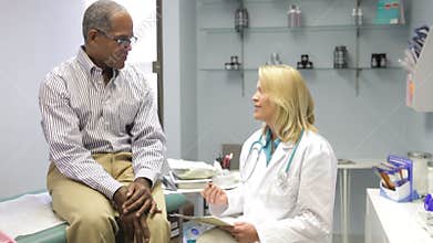 Doctor Examining Middle Aged Male Patient