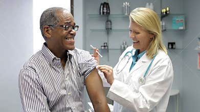 Doctor Giving Male Patient Injection