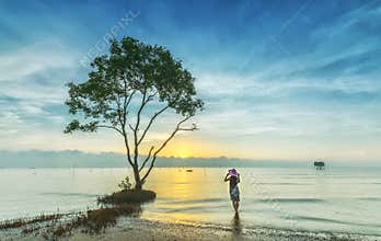 Girls dawn on the sea