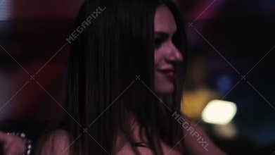 Go go girl in red suit dancing, winks. Slow motion