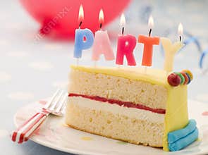Party Candles on a Slice of Birthday Cake