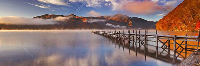 Jetty in Lake Chuzenji, Japan at sunrise in autumn