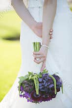 Wedding dress purple flower bouquet