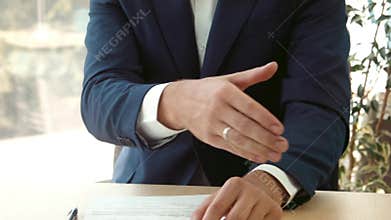 Signing of the contract and a handshake