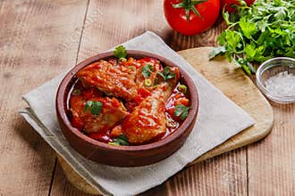 Chicken in tomato sauce in a bowl