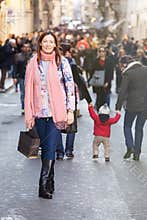 Young beautiful woman stands in a crowd of citizens