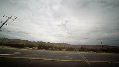 Looking out Side Window Driving along highway