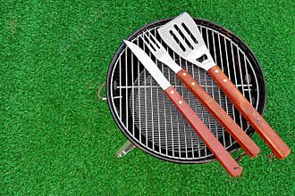 Close-up Top View Of Grill Tolls On The BBQ Appliance