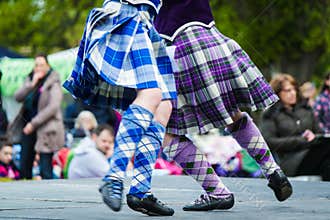Traditional scottish Highland dancing in kilts
