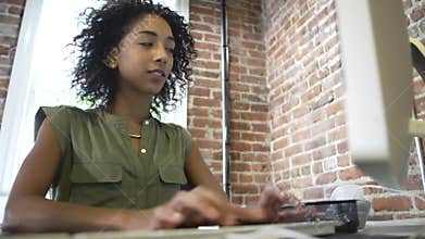 Time Lapse Sequence Of Businesswoman At Desk In Office