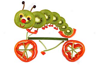 Creative food concept. Funny little caterpillar on a bicycle ma