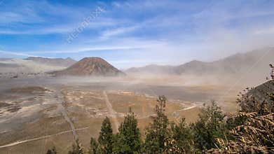 Daylight Sand Storm time lapse at Mount Batok, Bromo Tengger Semeru National Park, East Java, Indonesia.