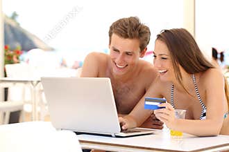 Couple buying online on holidays