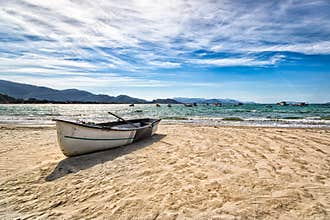 Boat resting in a nice beach in Florianopolis, Santa Catarina, Brazil.