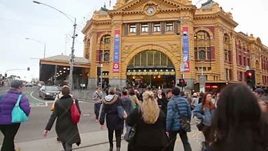 Point of view shot of people crossing a crosswalk in downtown Melbourne, Australia
