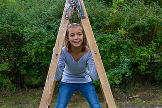 Young girl under relays happy playing