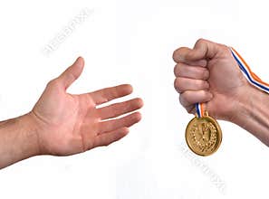 Award winner hand holding a gold medal