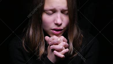 Teen girl praying