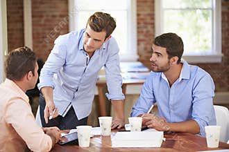 Group Of Businessmen Meeting To Discuss Ideas