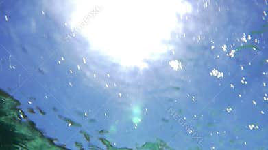Sun reflection on wavy water surface
