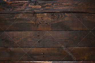 Dark brown rustic aged barn wood planks background