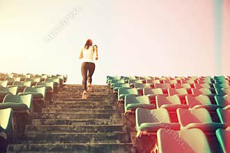 Athlete running on stairs. woman fitness jogging workout wellness concept.