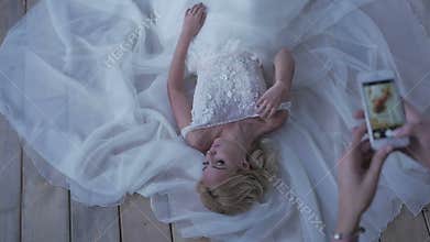 Beautiful bride posing in her wedding dress