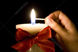 Lighting a Christmas candle
