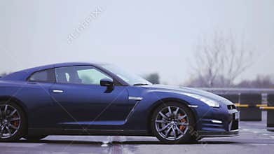 View of dark blue new coupe car. Wheels disks. Presentation. Showing. Luxury auto. Cold shades