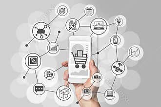 Mobile shopping experience with hand holding smartphone to connect to online shops to purchase consumer goods