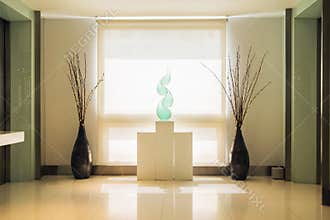 Luxury hallway with cyan fork of flame alike ornament on the mount