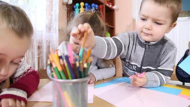 Children paint crayons