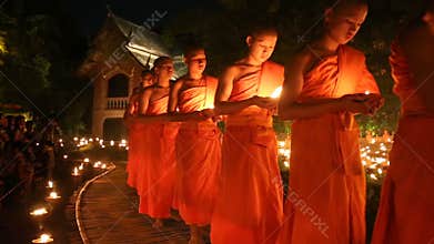 Magha puja day, Monks light the candle for buddha,