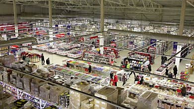 People buy products in large supermarket. Top view