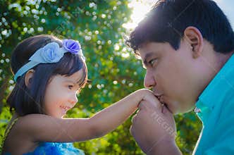Dad kissing dauther hand