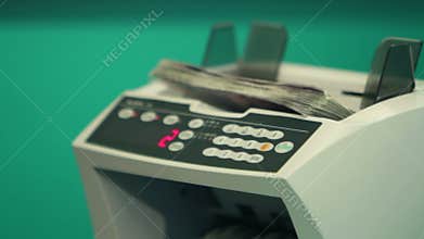 Woman banker learning to count money with counting machine