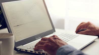 programmer working on laptop