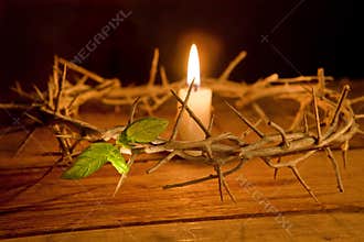 Crown of thorns and candle